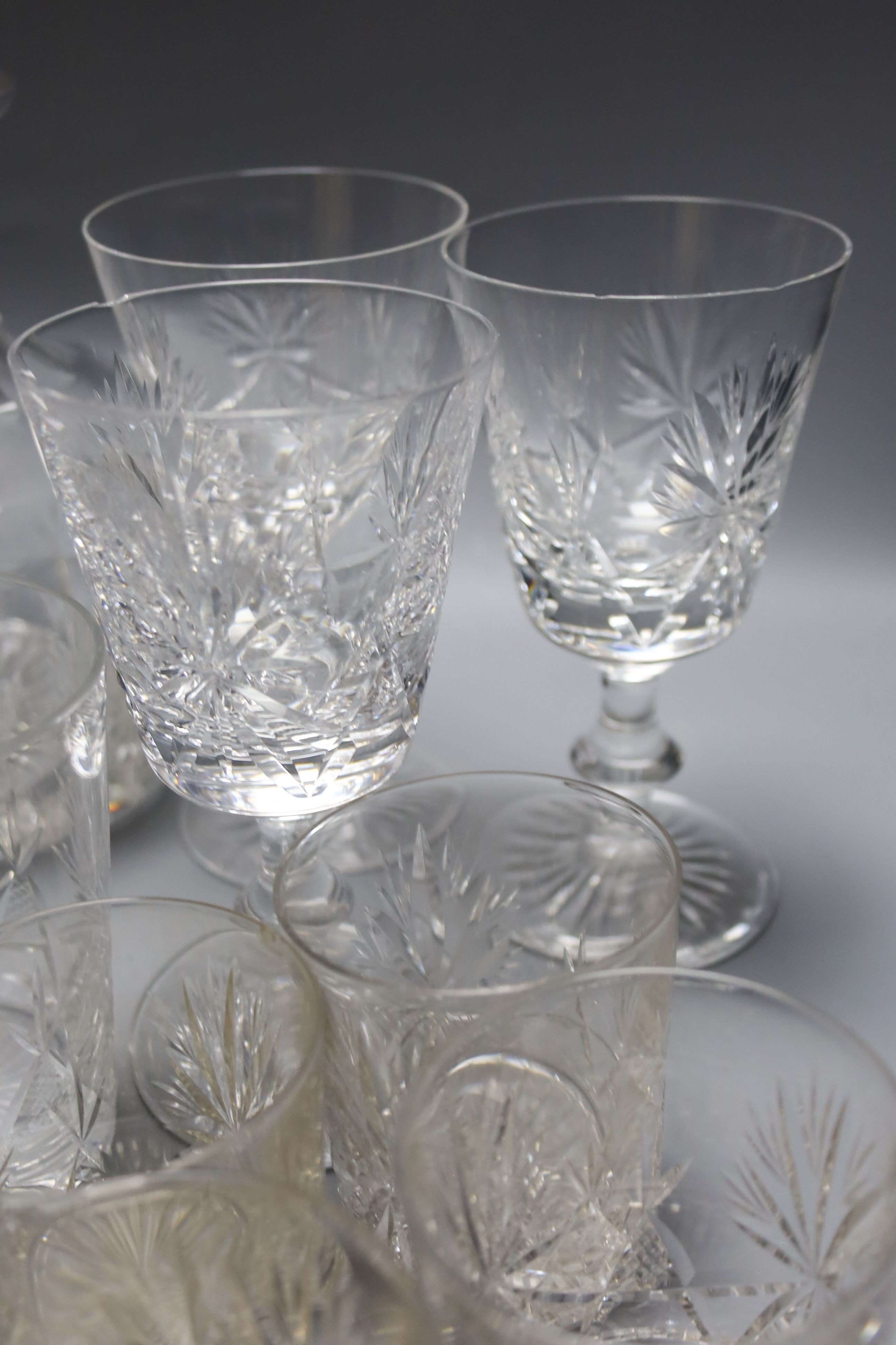 An assortment of ceramic and glass tableware. Also to include 18 pierced silver sweetmeet dishes